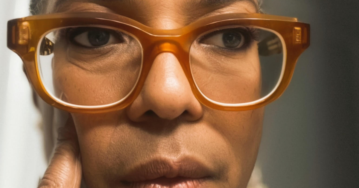 Close-up portrait of a thoughtful woman wearing amber glasses reflecting on stress, self-awareness, burnout, and losing yourself in responsibilities during overwhelming seasons of life.